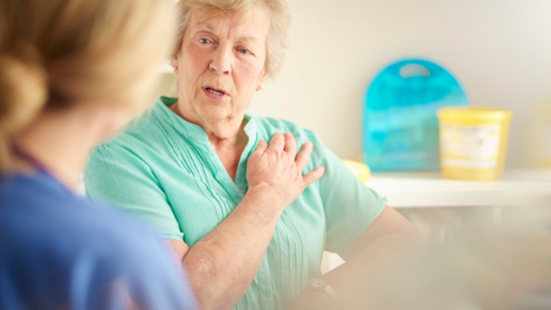 woman pointing her arm with medical professional