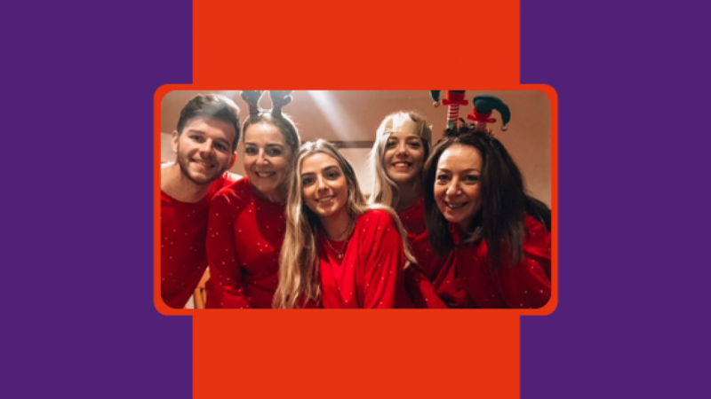 Group of five young people together smiling