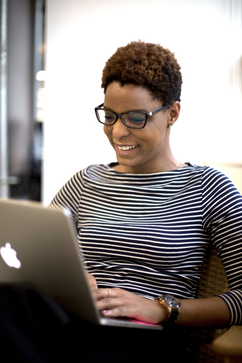 Woman browsing internet on laptop