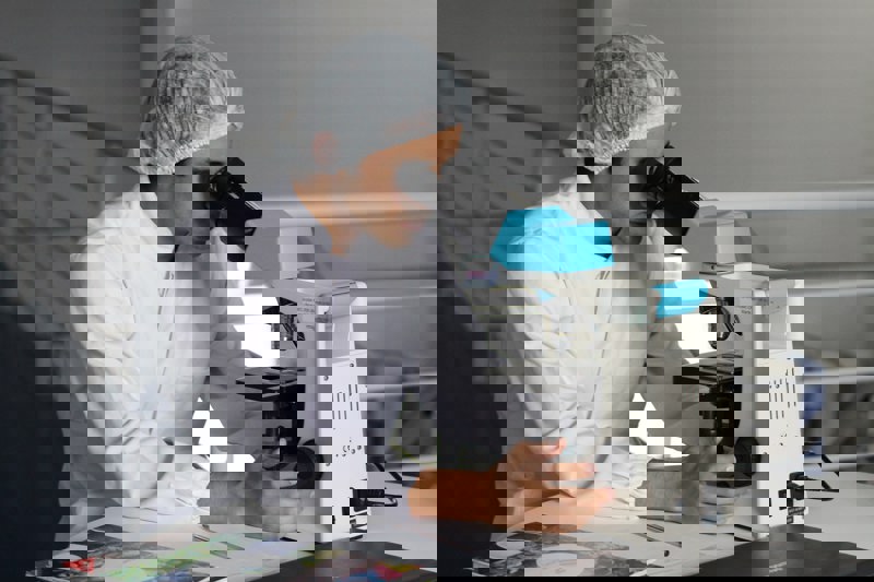 Man Using Microscope