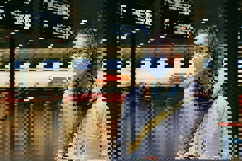 Woman Wearing Mask Travelling